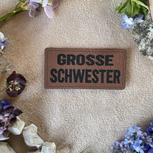 Kunstlederlabel "große Schwester"