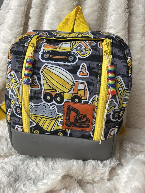 Lederlabel Bagger Klappack kitarucksack